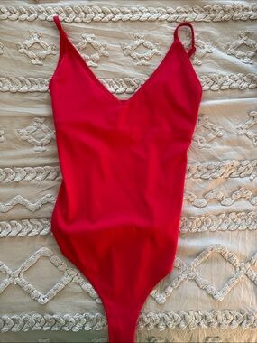 bright red garage bodysuit